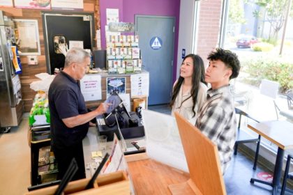 Food Allergens. Braxton Kimura, right, orders food with his mother Carol Kimura at Vitality Bowl in San Jose.  Credit: AP Photo/Terry Chea