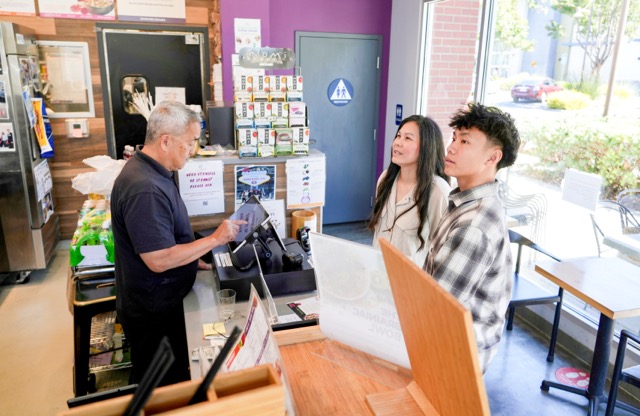 Food Allergens. Braxton Kimura, right, orders food with his mother Carol Kimura at Vitality Bowl in San Jose.  Credit: AP Photo/Terry Chea