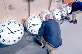 Fall Back. Clockmakers Rich Finn, left, and Tom Erb adjust the time zone controllers on a series of clocks that'll be installed at Paine Field in Everett, Wash., at the Electric Time Company, Wednesday, Oct. 30, 2024, in Medfield, Mass.  Credit: AP Photo/Charles Krupa