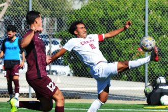 Norco College’s Ivan Morales (left) and Chaffey’s Armando Diaz (right) eye the ball after the header they were attempting bounces up away from them.