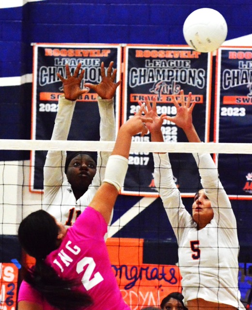Eastvale Roosevelt’s Chisom Ude (11) and Sophia Autran (5) try to block a shot by Riverside King’s Ariana Chavez (12). The Mustangs beat the Wolves 3 – 1.