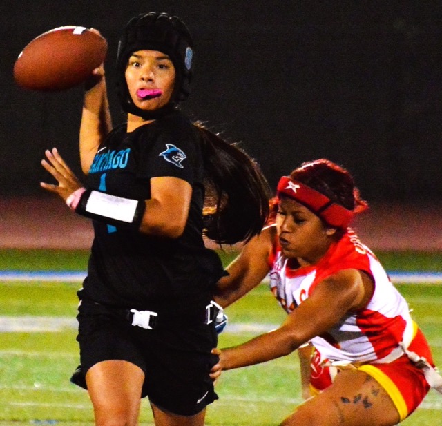 Santiago’s Priscilla Hernandez (left) looks for a receiver while Corona’s Kanani Urquidez (right) goes for the flag.