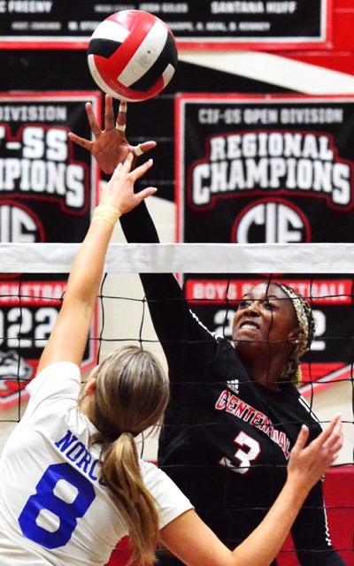 Norco’s Kayden Koning (8) and Corona Centennial’s Jordyn Wilson (3) battle for the ball above the net.  The Huskies defeated the Cougars 3 – 0.
