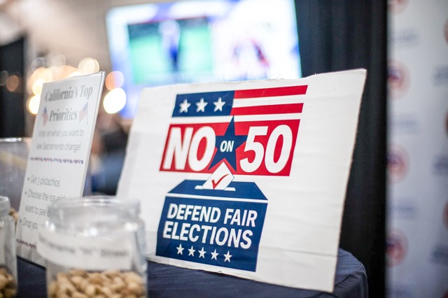 A “No on Prop 50” sign at the Kern County Republican Party booth at the Kern County Fair in Bakersfield on Sept. 26, 2025.

Credit: Photo by Larry Valenzuela, CalMatters/CatchLight Local