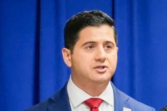 Acting U.S. Attorney Bill Essayli, during a news conference announcing an arrest made in the Palisades Fire, earlier this month..  Credit: AP Photo/Damian Dovarganes