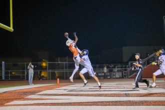 Coyotes #3 Traycee Washington just misses pulling in a pass that was thrown high in the endzone for an incompletion.