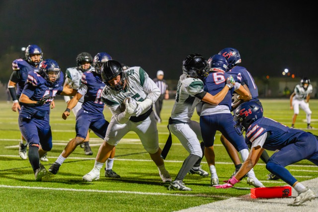 Perris Lineman #56 Richard Reyes receives a pass on a fake field goal, plows though defenders, and takes it to the house