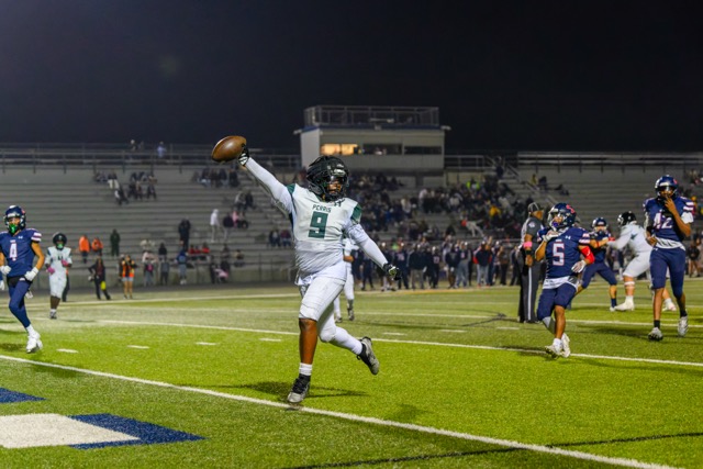 Panther #9 Logan Moore celebrates as he crosses the goal line on a 27-yard TD run