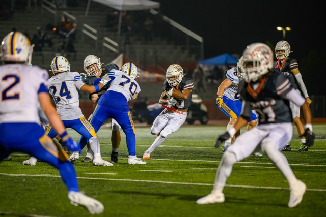 In a heartbreaking overtime loss, 27-26, the Orange Vista Coyotes lost their second round playoff game to the Agoura Chargers. Orange Vista’s (13) Zayshawn Washington makes a cut to the open hole created by the O-line.