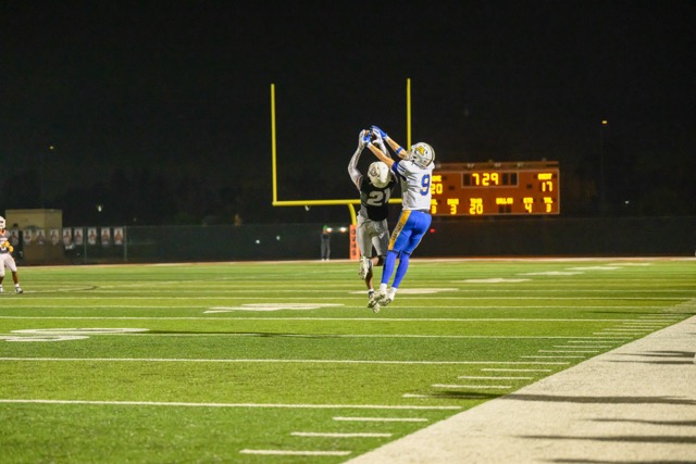 Coyote (21) Elijah Dowlou almost picks off a pass intended for Chargers (9) Luke Bussiere. Coming down from the play, Dowlou hit his head, and required medical attention