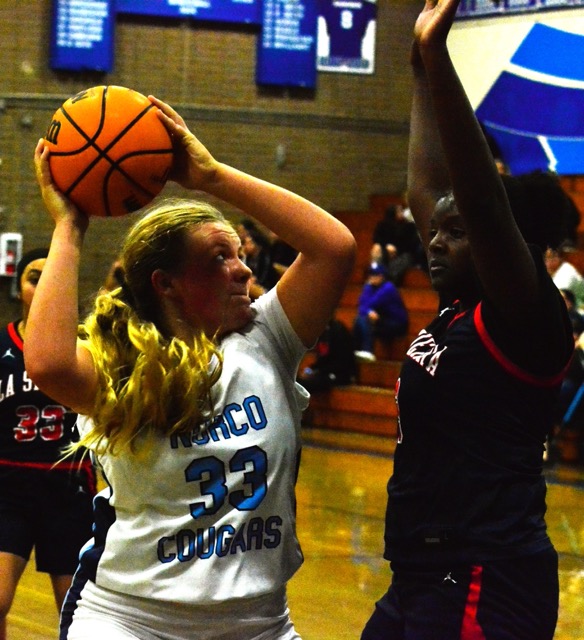 Norco’s Presley Brillhart (33) looks to put a shot against La Sierra’s Kayla Matthews (3).