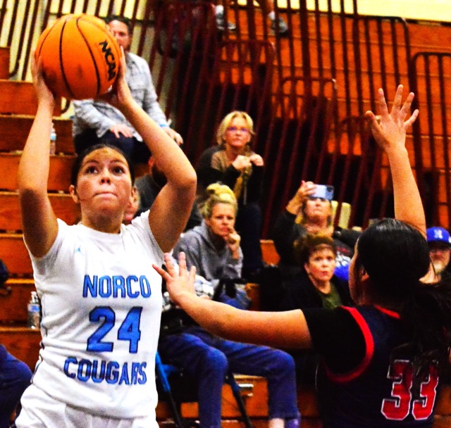 Norco’s Tiffany Montesinos (24) puts up a shot against La Sierra’s Isabella Ortega (33.Norco’s Tiffany Montesinos (24) puts up a shot against La Sierra’s Isabella Ortega (33.