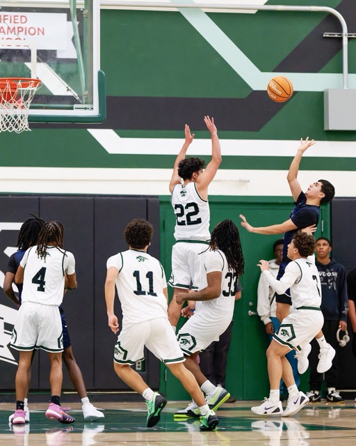 Featured Photos 12-19-2025. #22 Aiden Gutierrez attempts to contest a shot put up by a JW north player