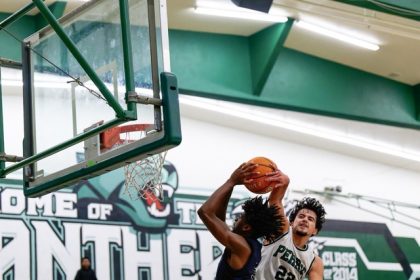 Eastvale Roosevelt goalie Aly Casteneda eyes Centennial’s Jayda Perez (7) as Perez winds up for a shot on goal during the Huskies’ 21 – 6 victory over the Mustangs.