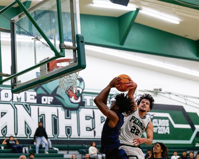 Eastvale Roosevelt goalie Aly Casteneda eyes Centennial’s Jayda Perez (7) as Perez winds up for a shot on goal during the Huskies’ 21 – 6 victory over the Mustangs.