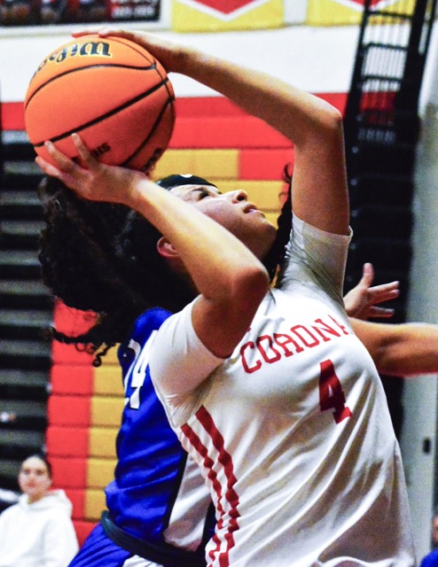Corona’s Gizelle Acosta (4) takes a shot against Beaumont. The Panthers defeated the Cougars 54 – 50.