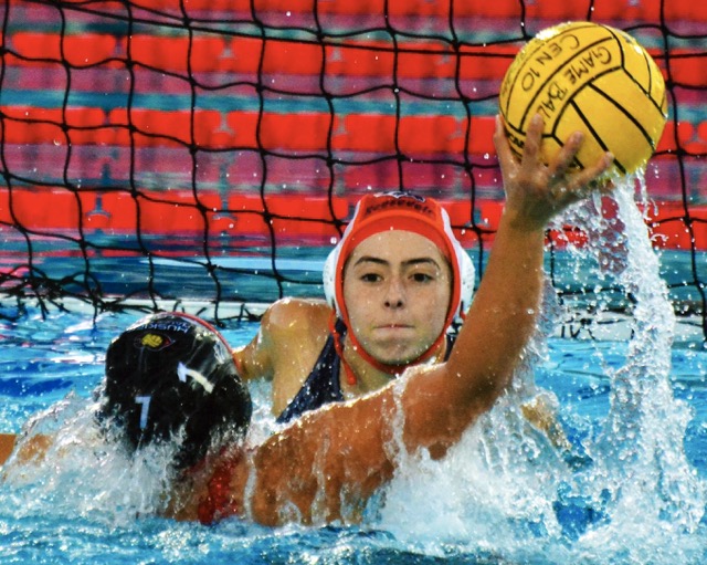 Eastvale Roosevelt goalie Aly Casteneda eyes Centennial’s Jayda Perez (7) as Perez winds up for a shot on goal during the Huskies’ 21 – 6 victory over the Mustangs.