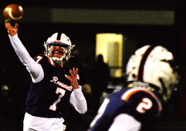 Featured Photos 11-28-2025. Eastvale Roosevelt QB Blake Nadler (7) eyes receiver Nathan Ramirez (2) early in the Mustangs CIF Division 6 semi-final playoff game against Pius X/St.Mathias of Downey. The pass was intercepted. The reigning CIF Division 8 champs defeated Roosevelt 39 – 6 to advance to the championship game against Ventura this weekend.