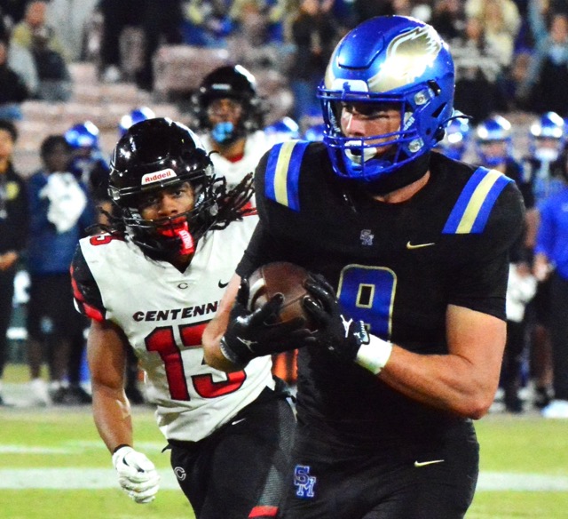 Santa Margarita’s Vai Manutai (left) hits Corona Centennial QB Dominick Catalano (8) while he attempts to pass during the second quarter of the CIF Division 1 Championship game played at the historic Rose Bowl in Pasadena.  The pass fell incomplete as Dash Fifita (0) rushes Catalano.  The Eagles captured the Open Division crown 42 – 7. Both of the Huskies’ losses this year were inflicted by Santa Margarita; the regular-season contest went to overtime.