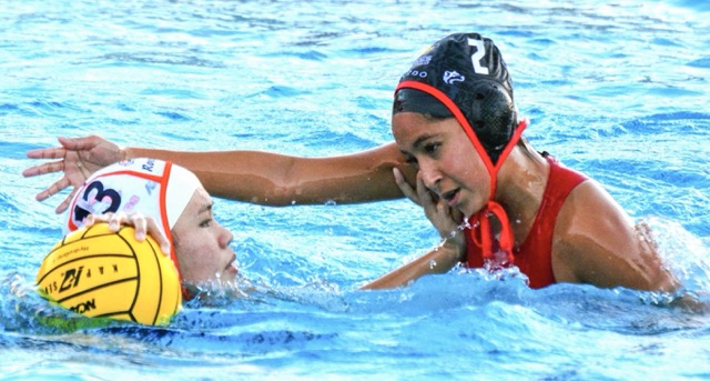 Eastvale Roosevelt’s Remy Tonthat (13) pushes back on Centennial’s Elena DeGante (2).