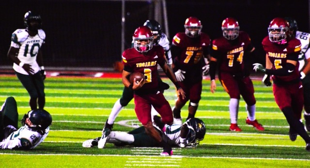 Hillcrest QB Matthew Ramos (3), who accounted for 6 touchdowns, heads for the end zone with his fifth in the first half in the Trojans’ 63 – 34 CIF Division 10 Championship game Saturday night. 