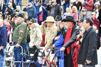 Day of Infamy. Veterans and attendees salute the Flag Dec. 7, 2023, during the Lake Norconian Club’s Annual Pearl Harbor Commemorative Ceremony at George Ingalls Veterans Memorial Plaza in Norco. Credit: Photo by Gary Evans