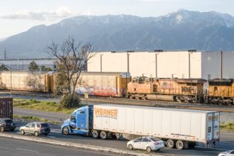 Limited Economic Growth. A truck and train cars near an Amazon sort center in Mira Loma on April 4, 2023. State lawmakers narrowly passed a bill regulating new warehouse sites and truck routes during the final hours of the 2024 legislative session. Photo by Aryana Noroozi for Black Voice News / CatchLight Local