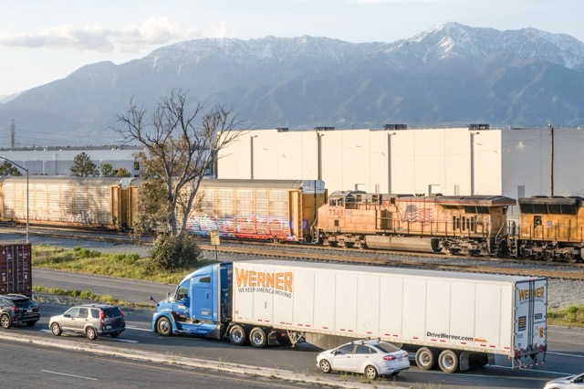 Limited Economic Growth. A truck and train cars near an Amazon sort center in Mira Loma on April 4, 2023. State lawmakers narrowly passed a bill regulating new warehouse sites and truck routes during the final hours of the 2024 legislative session. Photo by Aryana Noroozi for Black Voice News / CatchLight Local