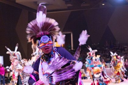 Kenan Begay, 18, from Flagstaff AZ, dances in the Pechanga Pow Wow, Sunday, January 11, in regalia that he made himself. Having started dancing at 3, he continues a long tradition of Pow Wow's - holding time, past, present and future. Credit: Lisa Zambrano