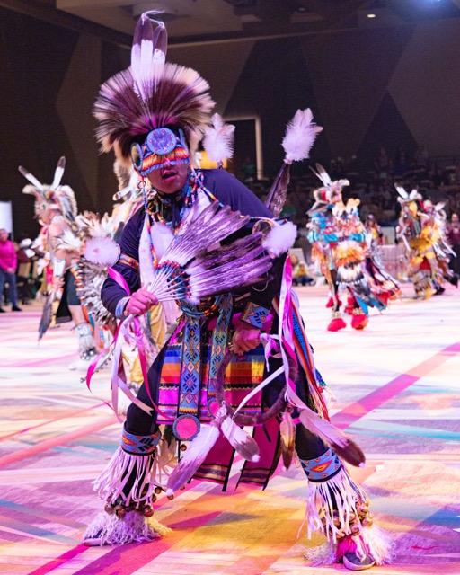 Kenan Begay, 18, from Flagstaff AZ, dances in the Pechanga Pow Wow, Sunday, January 11, in regalia that he made himself. Having started dancing at 3, he continues a long tradition of Pow Wow's - holding time, past, present and future. Credit: Lisa Zambrano