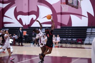 Wildcats #5 Winnie Madut attempts to block the shot