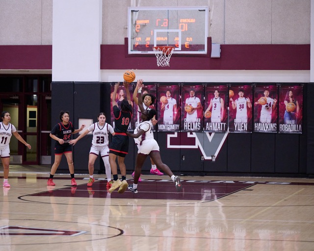 Rancho Verde’s #10 Dahnia Martin is fouled while being contested by a swarm of Paloma Valley defenders