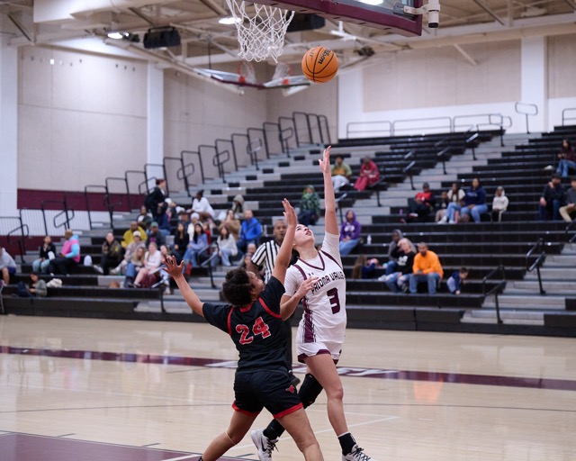 Paloma Valley #3 Keigan Souza steps in to a left handed layup on a breakaway while being challenged