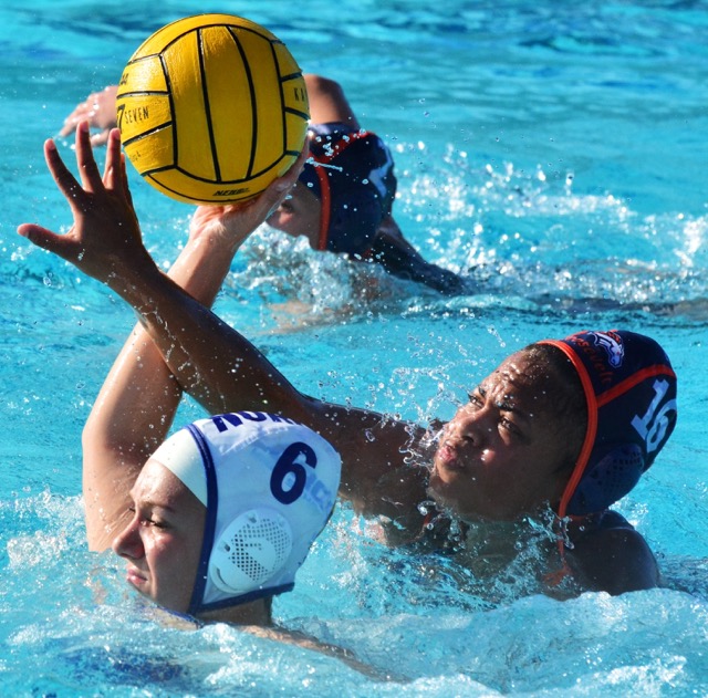 Norco’s Sadie Ringrose gets her shot blocked from behind by Roosevelt’s Taylor Morris during the Cougars 7 – 5 victory over the Mustangs.