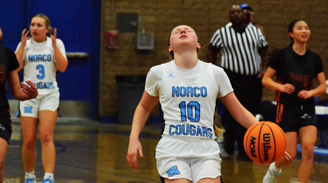 Norco’s Amber McClain (3) and Violet Vaught (10) react after Vaught was called for travelling during the Cougars 70 – 19 loss to Eastvale Roosevelt.