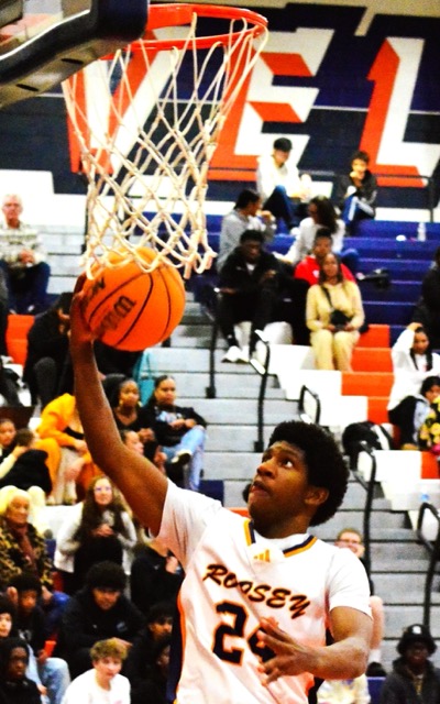 Eastvale Roosevelt’s Kymani Hunte (24) rolls in a layup against Santiago.