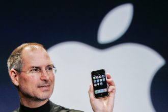 January 9. Apple CEO Steve Jobs holds up an Apple iPhone at the MacWorld Conference in San Francisco, in this Jan. 9, 2007 file photo.  Credit: AP Photo/Paul Sakuma