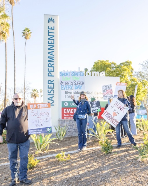 Kaiser Permanente nurses and healthcare workers represented by UNAC/UHCP participate in the 2026 strike, calling for improved wages, lower patient-to-nurse ratios, and stronger retirement benefits.  Credit: Photo by Lisa Zambrano