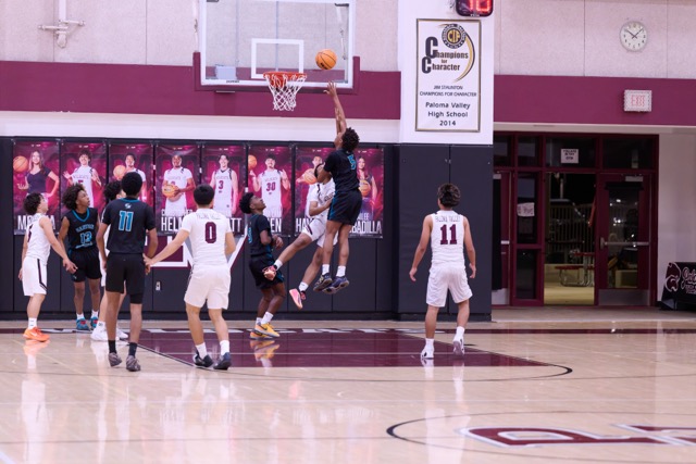 Canyon Springs #5 goes up for a tough layup after splitting the defense