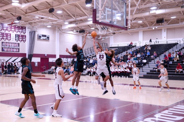 Wildcats #23 Michael Salas fouled hard while attempting a layup