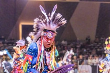 Kenan Begay, 18, from Flagstaff AZ, dances in the Pechanga Pow Wow, Sunday, January 11, in regalia that he made himself. Having started dancing at 3, he continues a long tradition of Pow Wow's - holding time, past, present and future. Credit: Lisa Zambrano