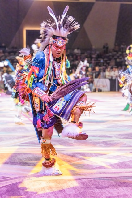 Kenan Begay, 18, from Flagstaff AZ, dances in the Pechanga Pow Wow, Sunday, January 11, in regalia that he made himself. Having started dancing at 3, he continues a long tradition of Pow Wow's - holding time, past, present and future. Credit: Lisa Zambrano