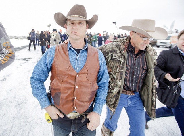 January 2. Ryan Bundy, one of the sons of Nevada rancher Cliven Bundy, walks to a news conference at Malheur National Wildlife Refuge Thursday, Jan. 7, 2016, near Burns, Ore. A small, armed group occupying the wildlife preserve has said repeatedly that local people should control federal lands, but critics say the lands are already managed to help everyone from ranchers to recreationalists.  Credit: AP Photo/Rick Bowmer)