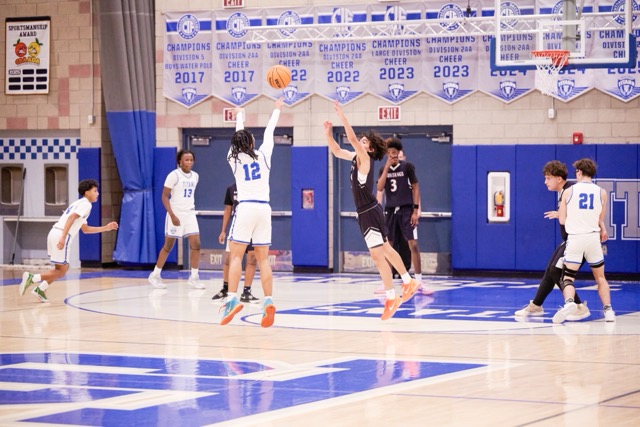 Titans #12 Legend Jenkins shoots a contested 3 pointer and drains it from deep