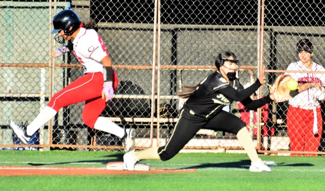 Centennial freshman DeMia Swanson beats out the throw on an infield chopper.