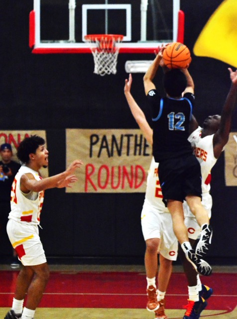 Walnut’s Jeremiah Vasquez (12) launches the contested buzzer-beating three-pointer to defeat Corona 71 – 70 in the second round of the CIF playoffs.