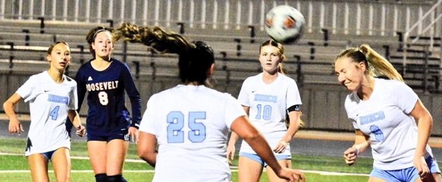 Eastvale Roosevelt’s Emma Gause (8) and Norco’s Peyton Maxon (4), Ella Moreno (25), and Camryn Wagner (10) watch Briana Sousa (9) head the ball out of the goal crease during the Mustangs 2 – 0 win over the Cougars.