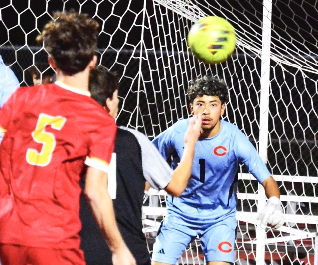 Corona’s Martin Nunez (5) and Corona Centennial’s Johnny Soto (center) watch as the ball goes through the crease in front of goalkeeper Chris Salazar (1) during the Panthers’ 1 – 0 victory over the Huskies.