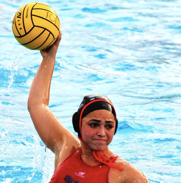 Corona Centennial’s Elizabeth Finger (6) aims before firing a scoring shot. The Huskies defeated the Wolverines 19 – 4.