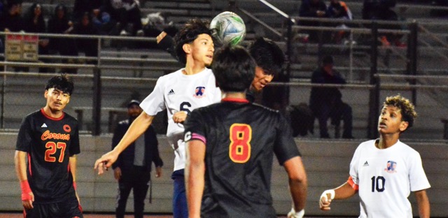 Corona’s Jair Anguiano (27) and Miguel Rocha Garcia (8) watch Roosevelt’s Eduardo Nuno (6) and Panther Edwin Carbajal head the ball while Mustang Emmanuel Bekele (10) watches during a scoreless tie.